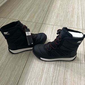 Girls Sorel winter boots in size 2. Never worn, brand new with tags.